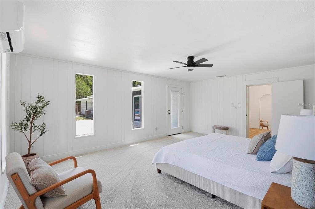 980 Southwest 105th Street Trenton, FL 32693 - Photo 16 of 43 a bedroom with a bed and a chair