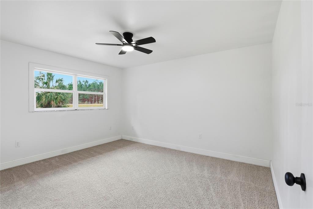980 Southwest 105th Street Trenton, FL 32693 - Photo 22 of 43 a view of an empty room with a window