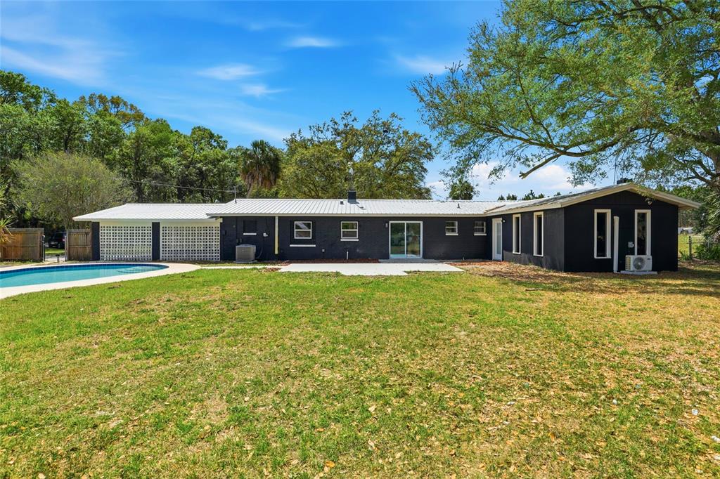 980 Southwest 105th Street Trenton, FL 32693 - Photo 28 of 43 a front view of a house with a garden