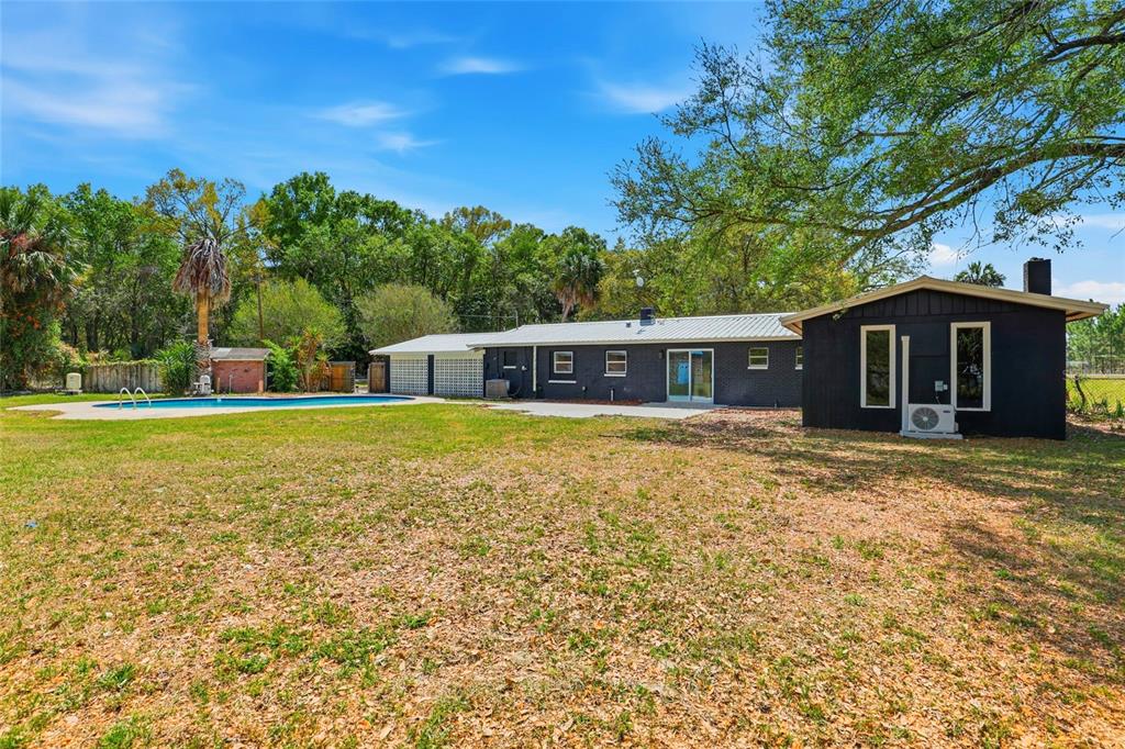 980 Southwest 105th Street Trenton, FL 32693 - Photo 29 of 43 a front view of a house with a yard