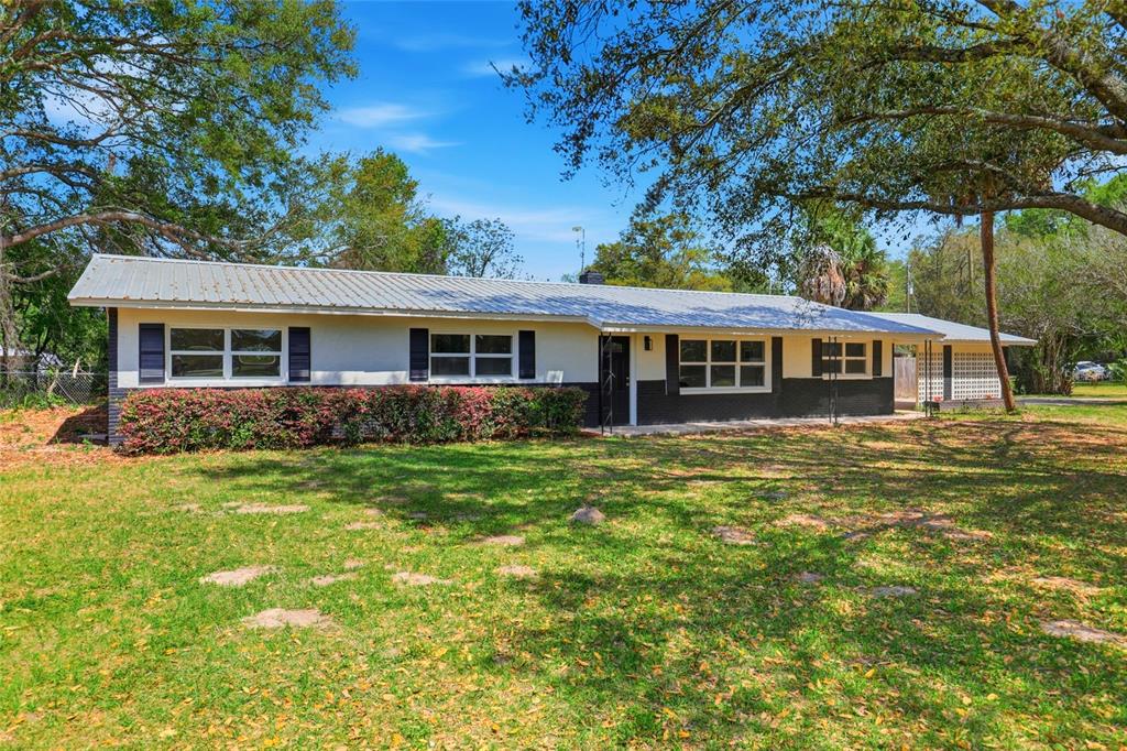 980 Southwest 105th Street Trenton, FL 32693 - Photo 3 of 43 a view of a house with a backyard