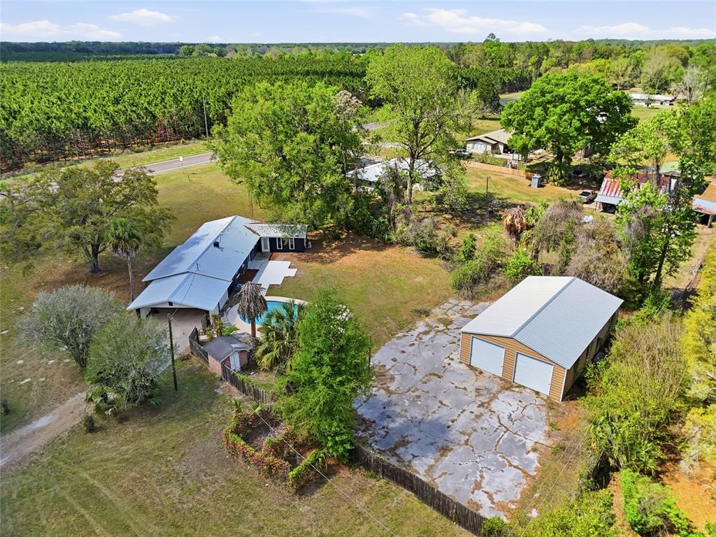 980 Southwest 105th Street Trenton, FL 32693 - Photo 40 of 43 an aerial view of a house with garden space and street view