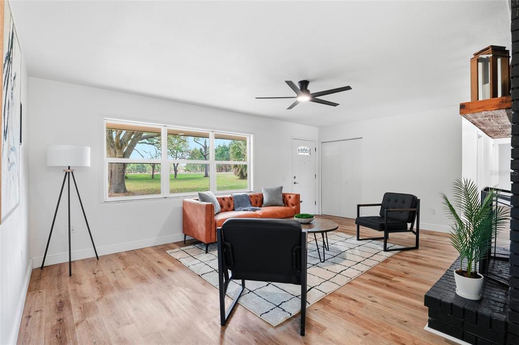 980 Southwest 105th Street Trenton, FL 32693 - Photo 6 of 43 a living room with furniture and a large window