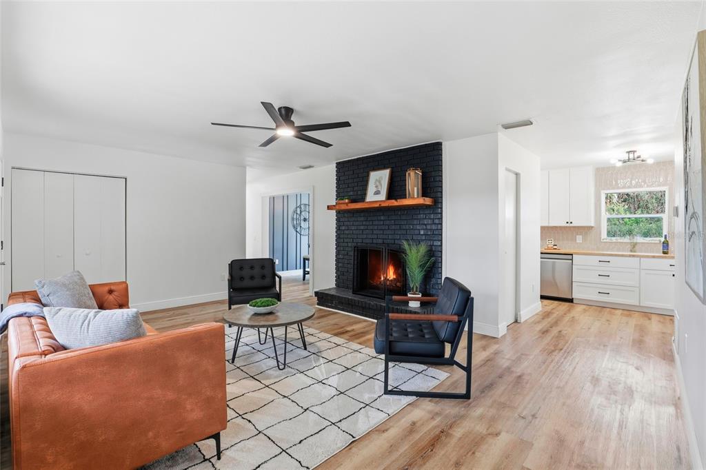 980 Southwest 105th Street Trenton, FL 32693 - Photo 7 of 43 a living room with furniture and a fireplace