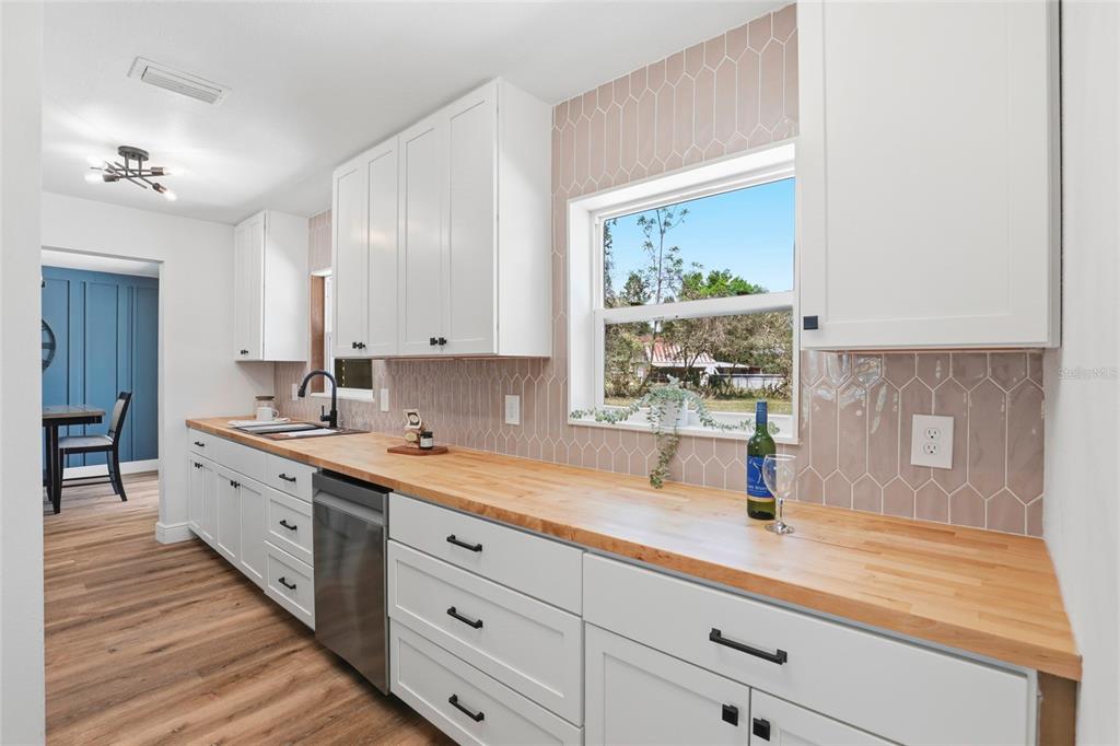980 Southwest 105th Street Trenton, FL 32693 - Photo 10 of 43 a spacious bathroom with a double vanity sink and a window