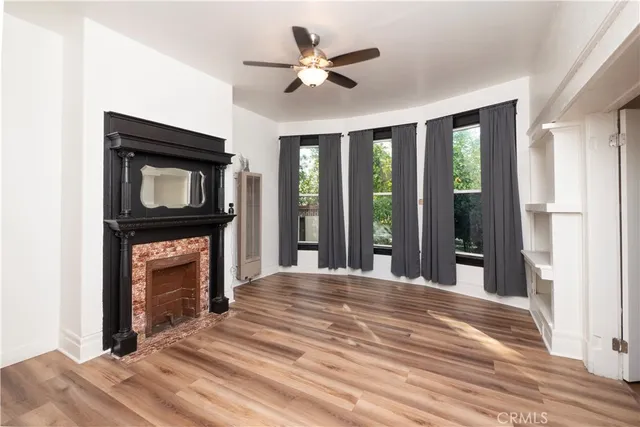 a bedroom with a bed and a fireplace