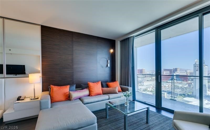 4381 West Flamingo Road, Unit 15310 Las Vegas, NV 89103 - Photo 10 of 52 Living area with a view of city and expansive windows