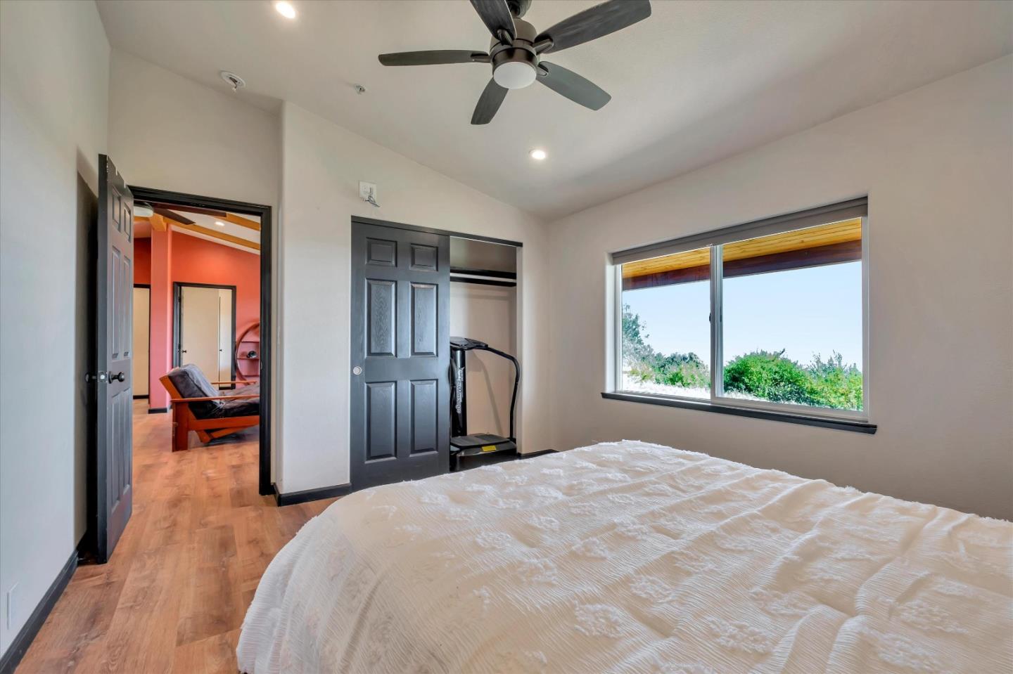 620 Maymens Flat Road Los Gatos, CA 95033 - Photo 26 of 42 a bedroom with a bed and a large window