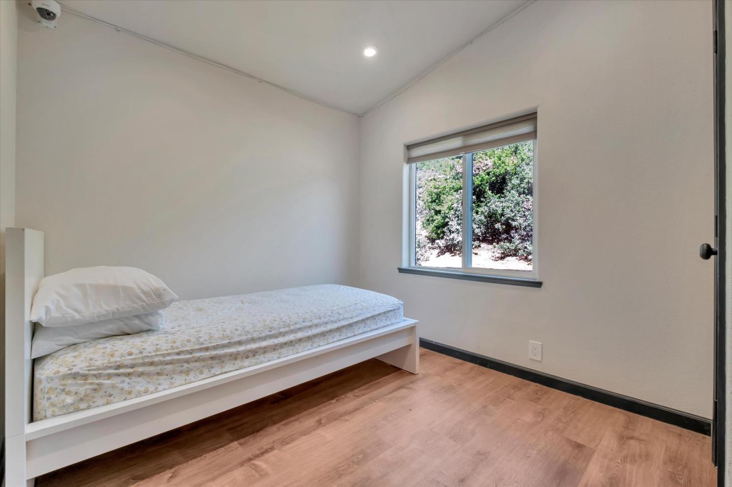 620 Maymens Flat Road Los Gatos, CA 95033 - Photo 30 of 42 a bedroom with a bed and a window