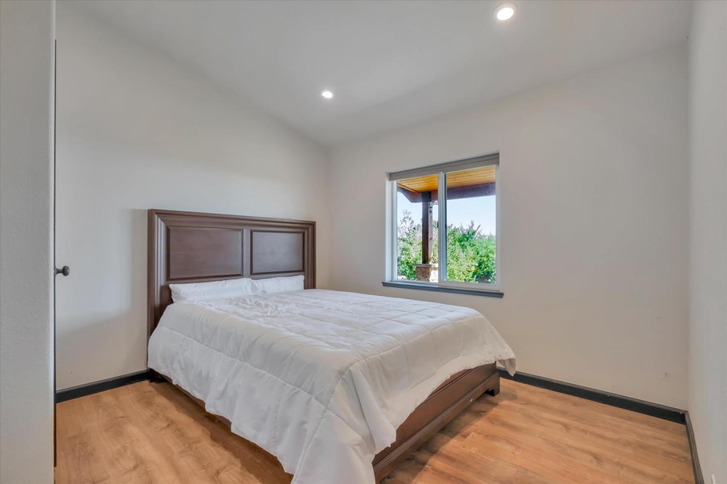 620 Maymens Flat Road Los Gatos, CA 95033 - Photo 33 of 42 a bedroom with a bed and window