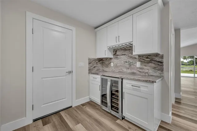 a kitchen with stainless steel appliances granite countertop a stove and a refrigerator