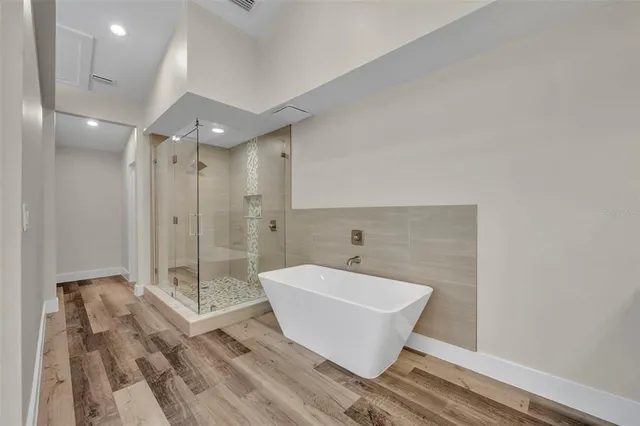 a bathroom with a bathtub and shower