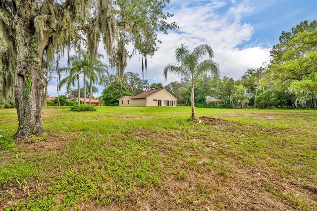 a view of a garden with a house
