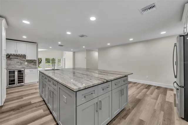 a kitchen with a sink and stove