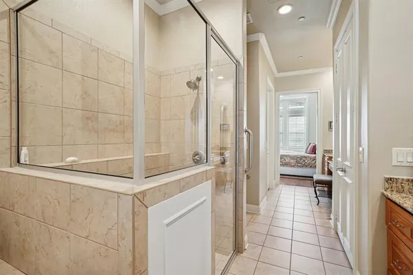 a bathroom with a glass shower door