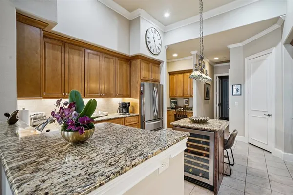 a kitchen with a refrigerator and a table