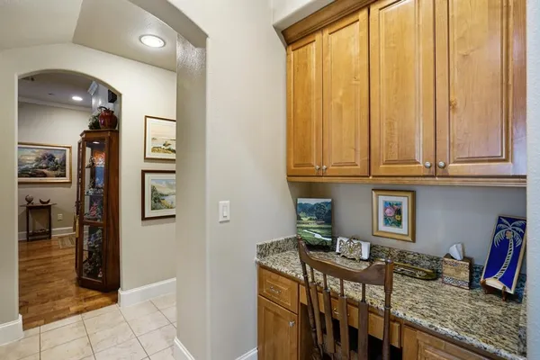 a view of a kitchen with furniture and a window
