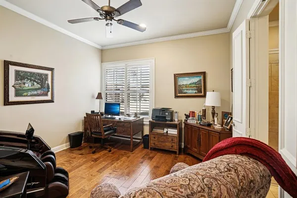 a bedroom with furniture and a window
