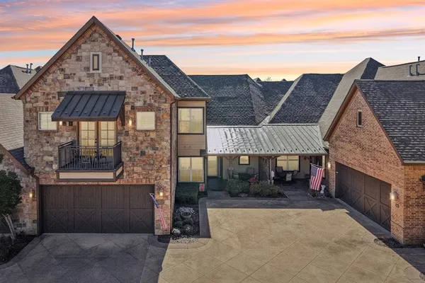 a front view of a house with a garage