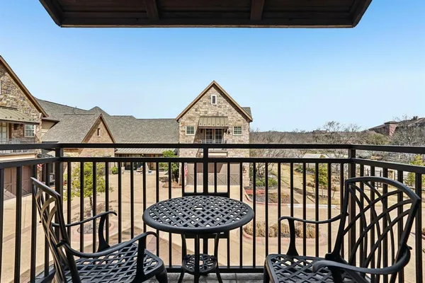 a view of a balcony with furniture