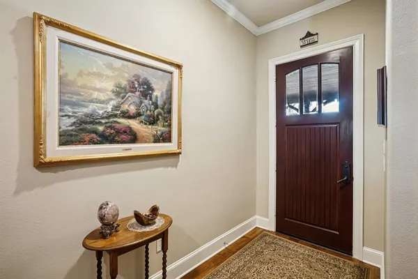 a view of a hallway with front door