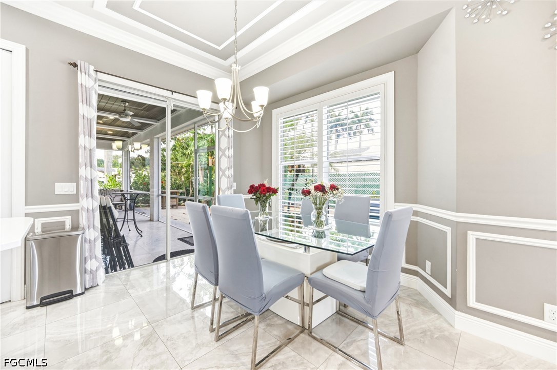 1700 43rd Terrace Southwest Naples, FL 34116 - Photo 29 of 38 a view of a dining room with furniture window and outside view