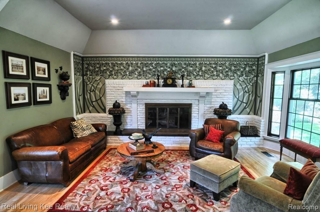 5988 Cobb Creek Road Rochester, MI 48306 - Photo 4 of 27 The natural fireplace is surrounded by a hand painted mural. Enjoy the view from the new bay window.