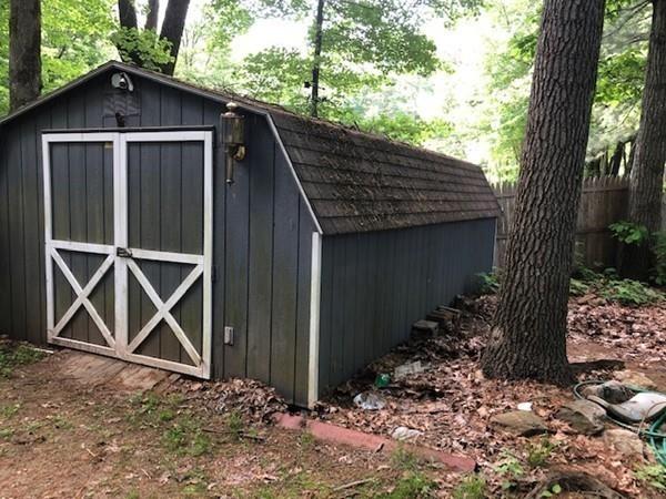 69 Pine Road Charlton, MA 01507 - Photo 13 of 26 a front view of house with backyard