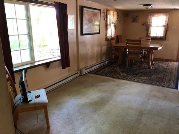 69 Pine Road Charlton, MA 01507 - Photo 14 of 26 a dining room with furniture and a window