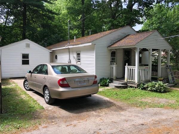 69 Pine Road Charlton, MA 01507 - Photo 2 of 26 a front view of a house with garden