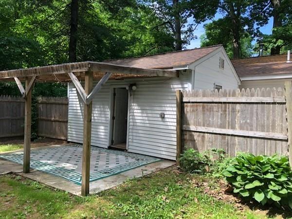 69 Pine Road Charlton, MA 01507 - Photo 3 of 26 a view of a house with a small yard and a large tree
