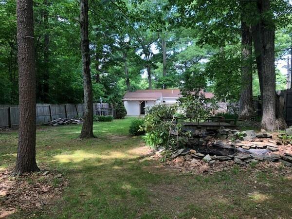 69 Pine Road Charlton, MA 01507 - Photo 7 of 26 a view of a yard with a tree
