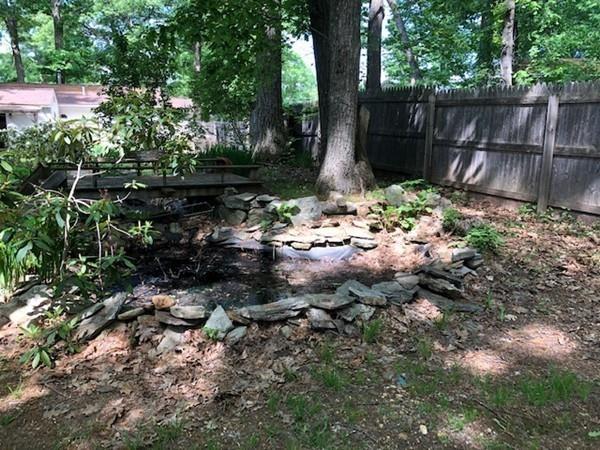 69 Pine Road Charlton, MA 01507 - Photo 8 of 26 a backyard of a house with lots of green space