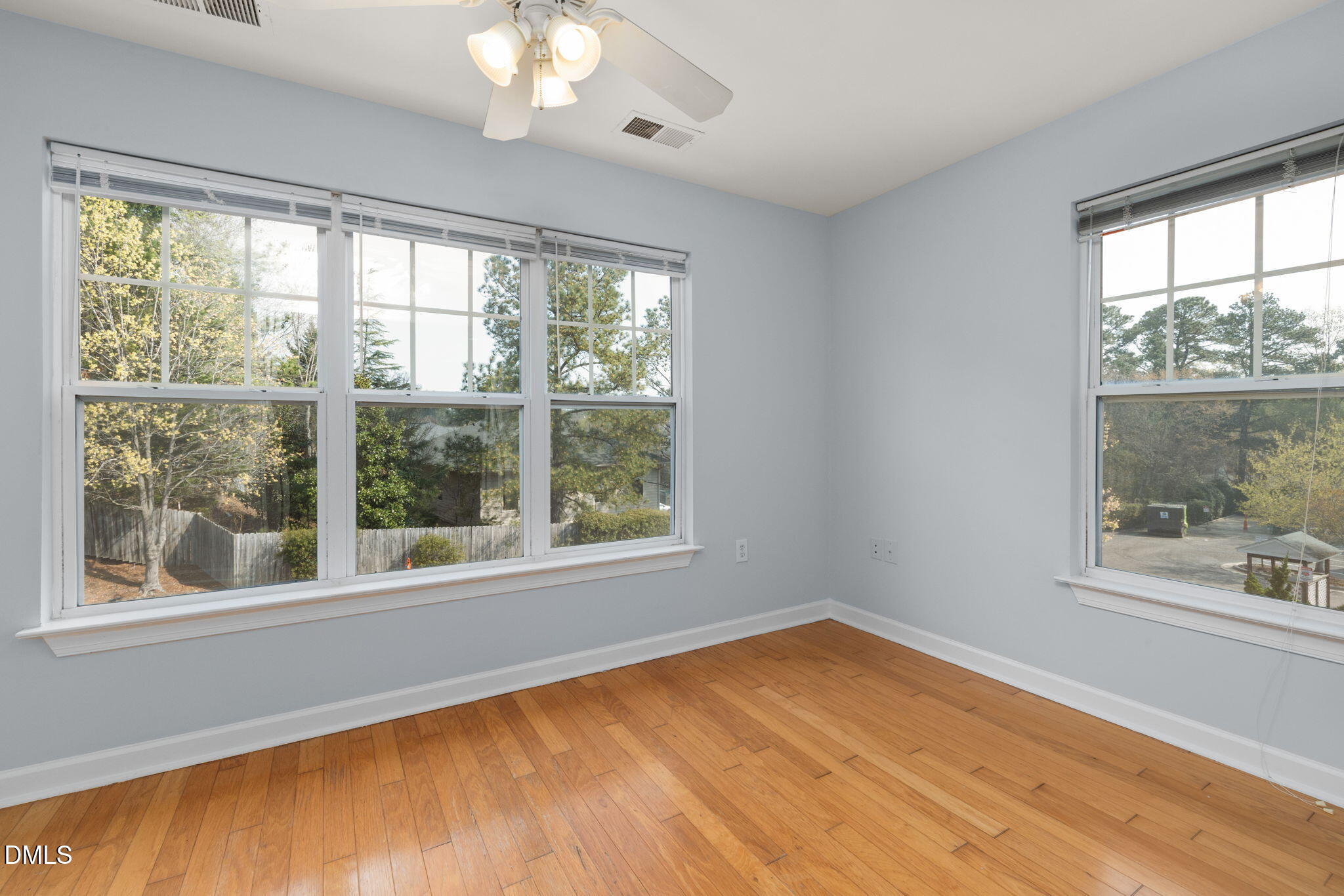 929 Morreene Road, Unit C23 Durham, NC 27705 - Photo 15 of 33 a view of empty room with wooden floor and fan