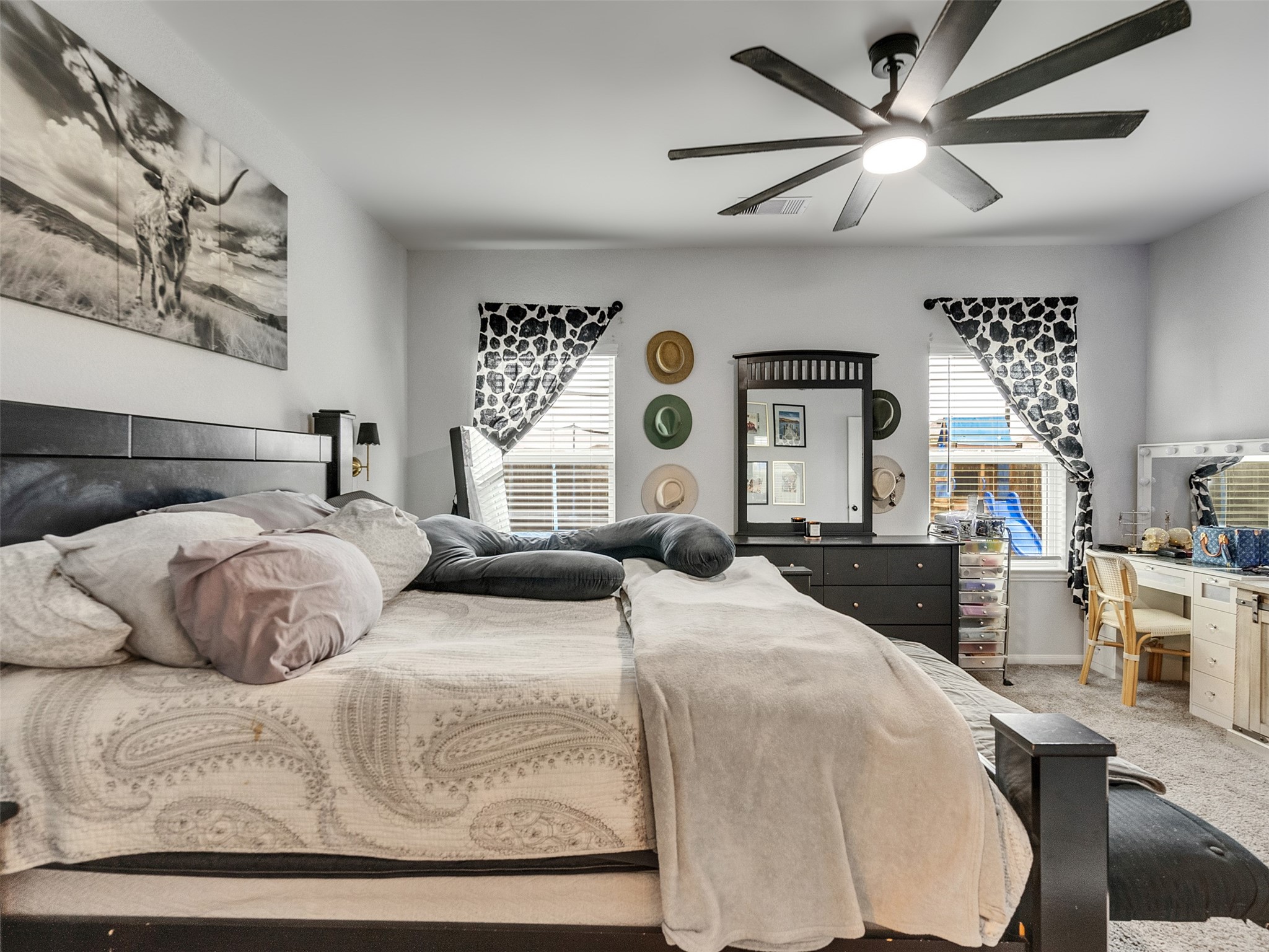 8719 Willet Street Baytown, TX 77521 - Photo 34 of 42 a bedroom with a large bed and a chandelier