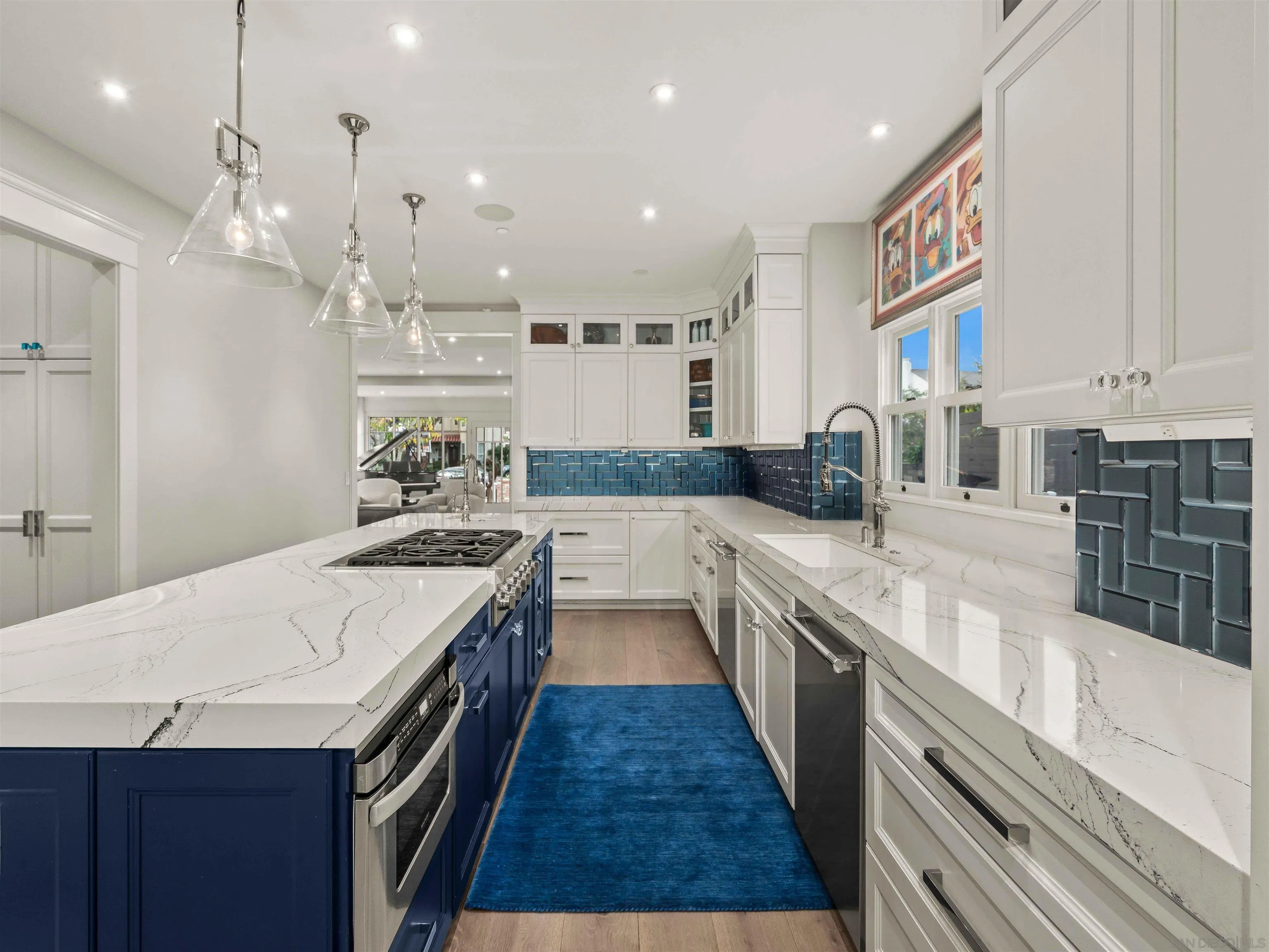 1027 G Avenue Coronado, CA 92118 - Photo 14 of 59 a kitchen with stainless steel appliances granite countertop a sink and stove