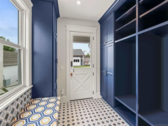 a kitchen with kitchen island granite countertop a sink and a stove