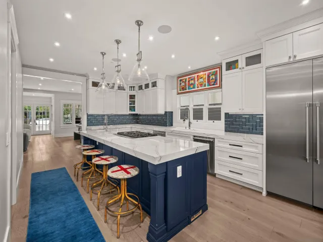 a living room with furniture a desk and chair with wooden floor