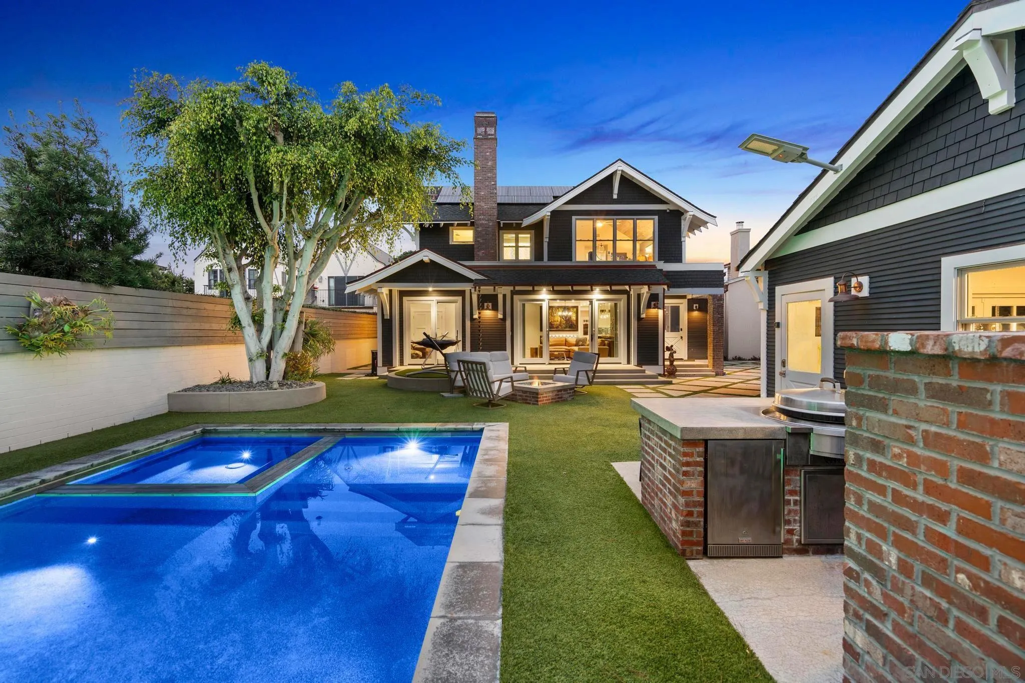 1027 G Avenue Coronado, CA 92118 - Photo 25 of 59 a front view of a house with swimming pool yard and outdoor seating