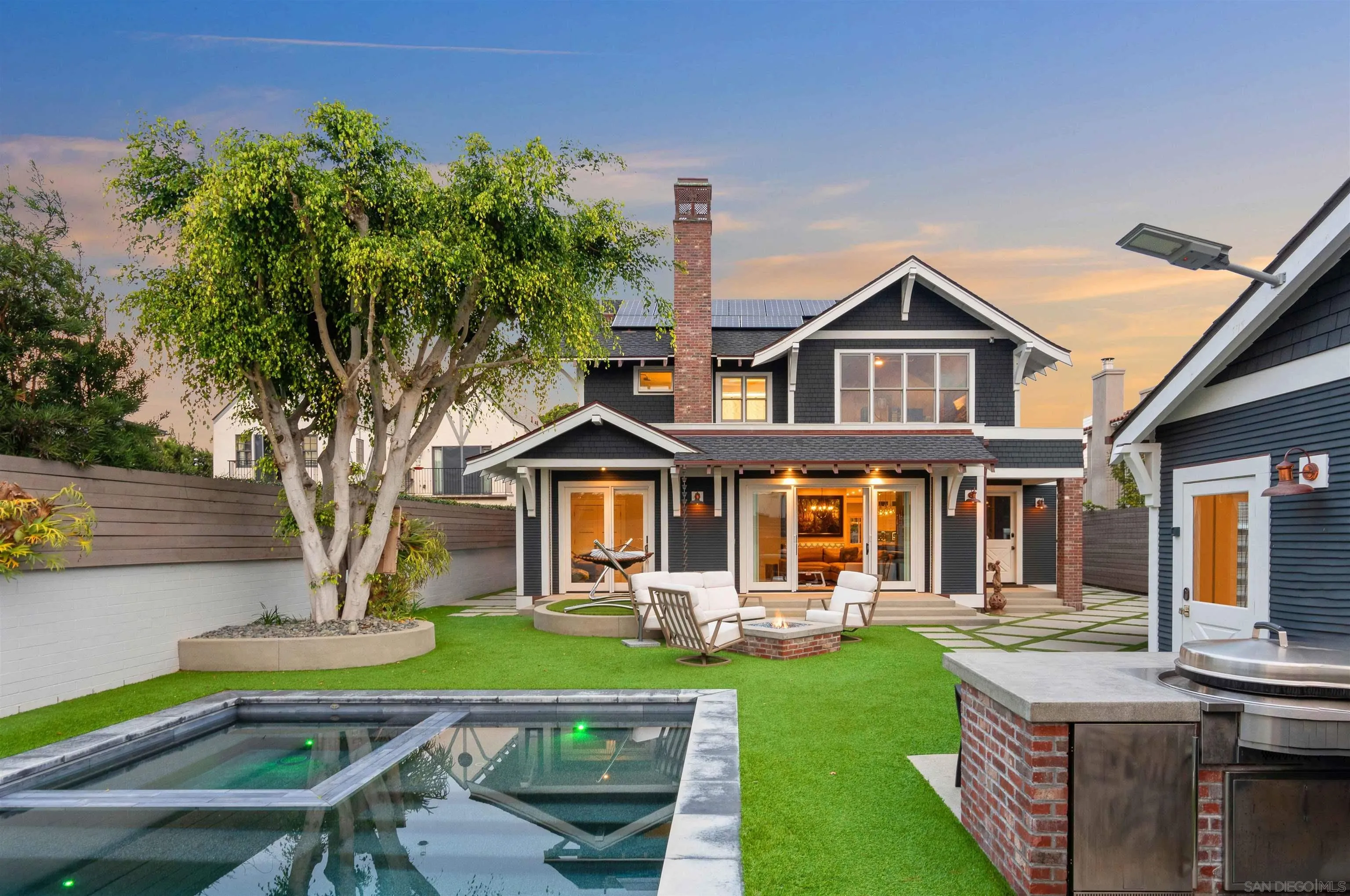 1027 G Avenue Coronado, CA 92118 - Photo 28 of 59 a front view of a house with porch and garden
