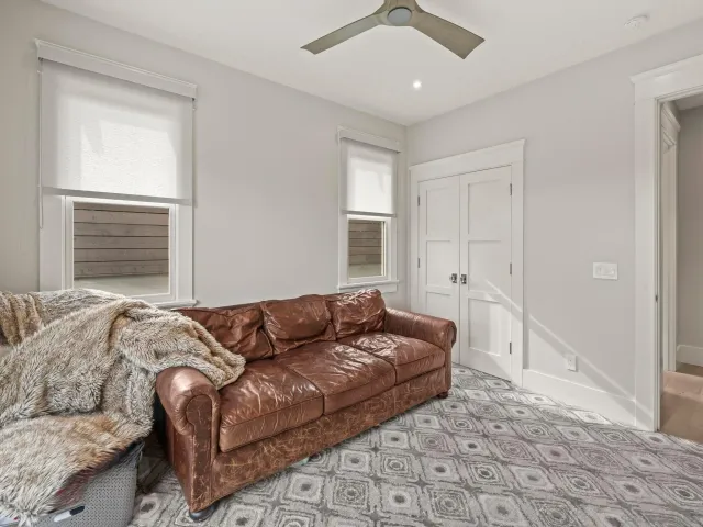 a bathroom with a double vanity sink a mirror and a bathtub