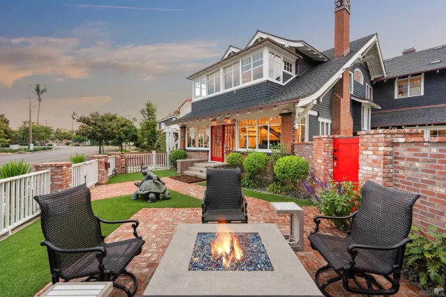 a view of a patio with couches chairs and a potted plant