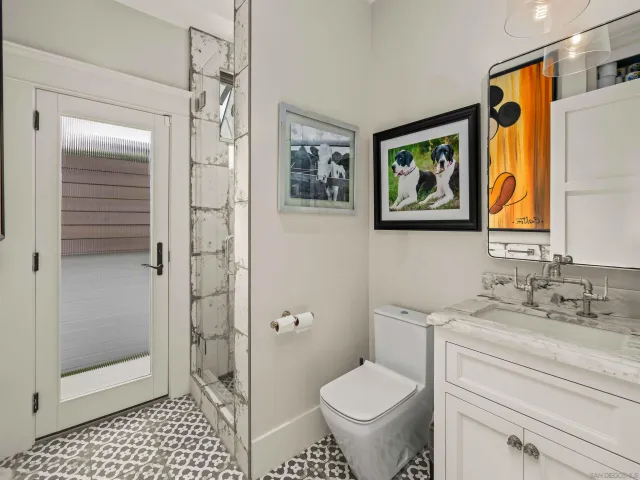 a bathroom with double sink and a mirror