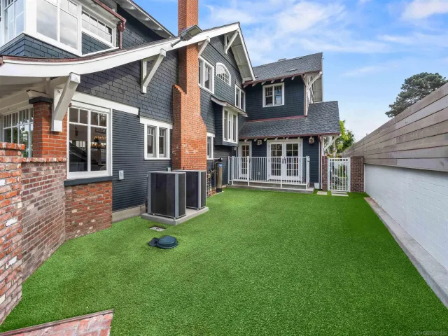 a utility room with cabinets washer and dryer