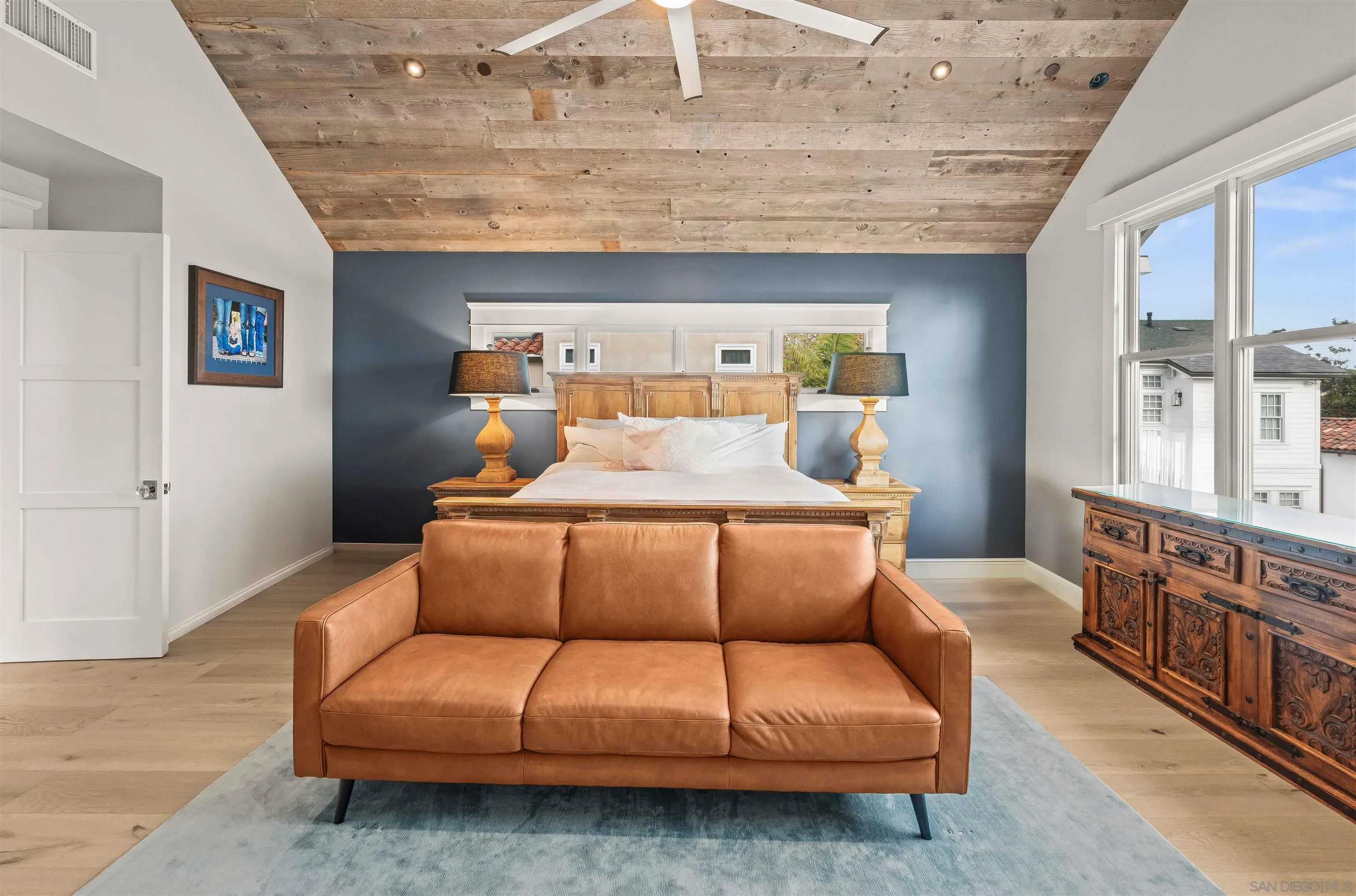 1027 G Avenue Coronado, CA 92118 - Photo 39 of 59 a living room with furniture and a chandelier