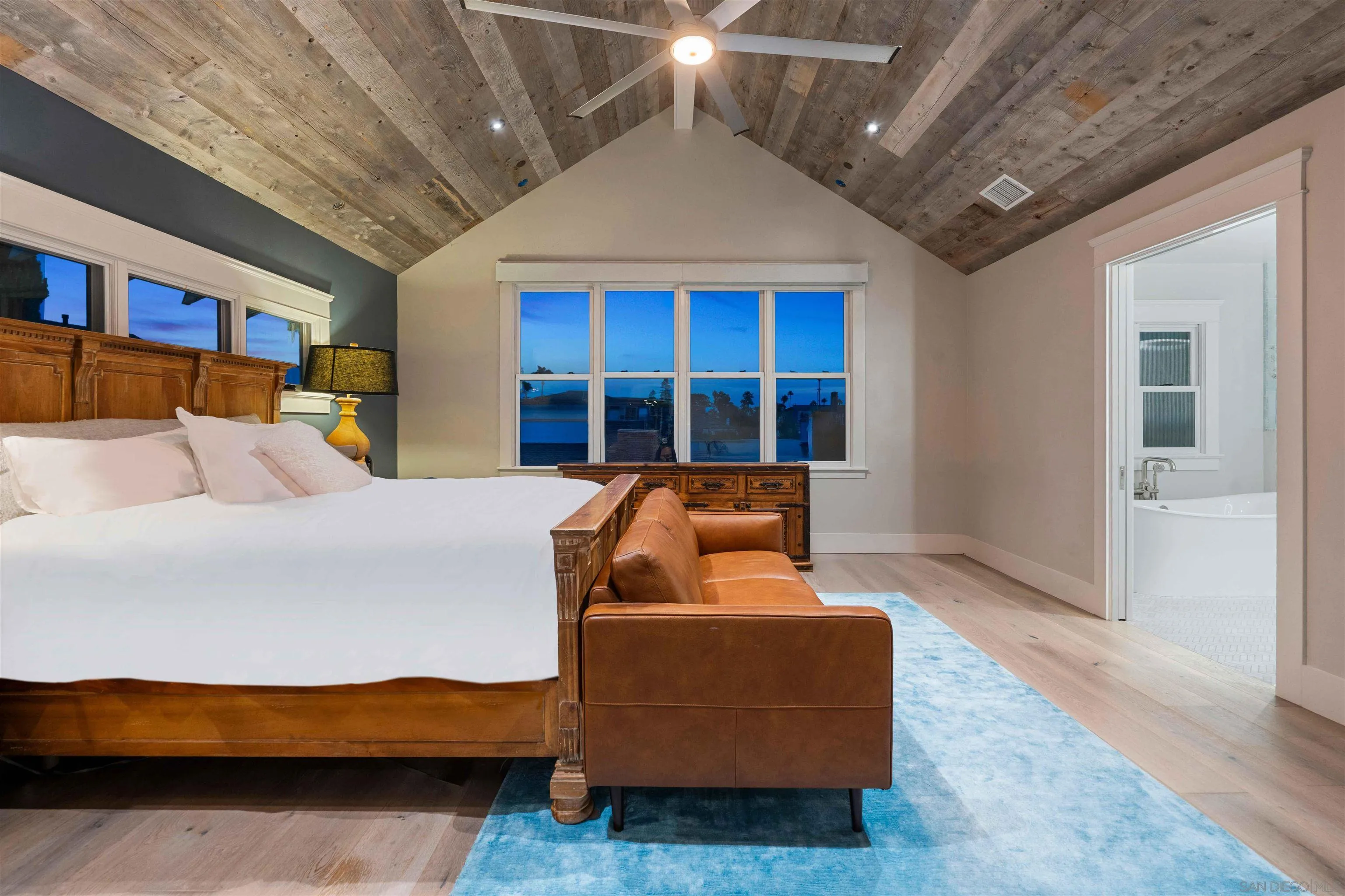 1027 G Avenue Coronado, CA 92118 - Photo 40 of 59 a bed room with furniture and a potted plant