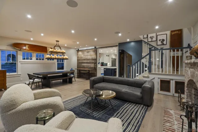 a living room with fireplace furniture and a flat screen tv