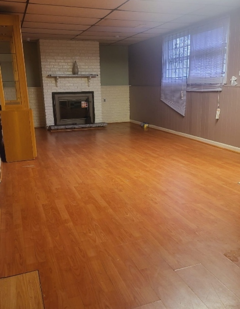 1637 215th Place Sauk Village, IL 60411 - Photo 2 of 11 an empty room with windows