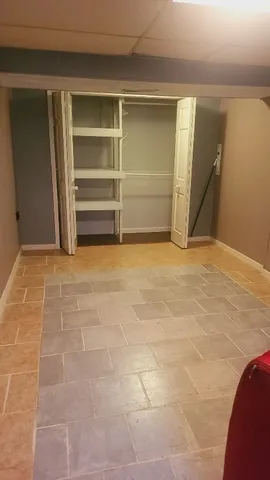 a view of an empty room with a fireplace