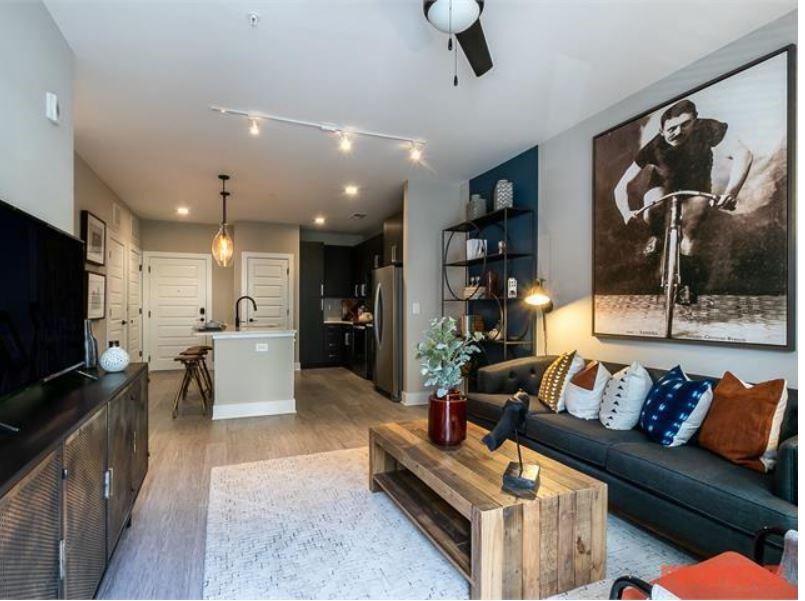 2855 Crescent Parkway, Unit 731 Atlanta, GA 30339 - Photo 3 of 6 a living room with furniture and a flat screen tv